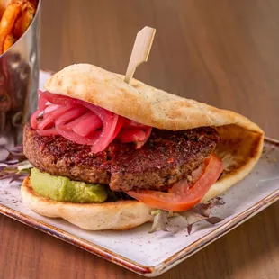 The Bad Hunter

Impossible Burger, Field Green Salad, Roasted Tomato, Avocado Mash, Pickled Onions, Naan Bread
