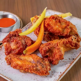 Wingman 6/12

Bone-in Wings tossed with Choice of Buffalo, Honey-Sriracha or BBQ, Served with Ranch or Blue Cheese Dressing