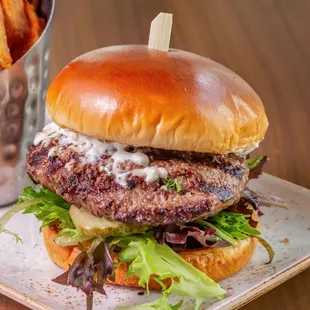 Embassy Burger

Angus Steak Burger, Choice of American, Swiss or Cheddar Cheese, Lettuce, Tomato, Brioche Bun