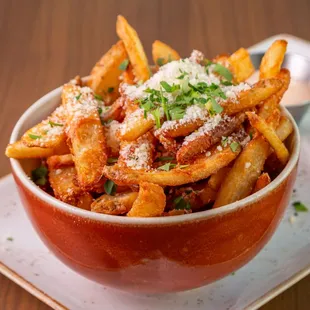 Truffle Fries

Truffle Oil, Parmesan Cheese, Parsley, Served with Roasted Garlic Aioli