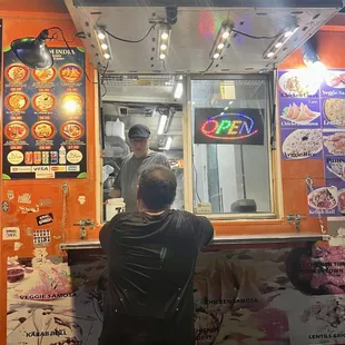 side view and side window of food truck where you pick up your order