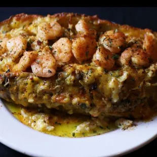a plate of food with shrimp and broccoli