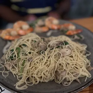 a plate of pasta and shrimp