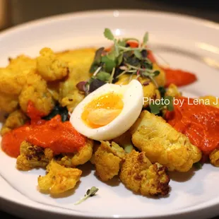 Roasted Cauliflower ($30) - wilted greens, poached egg, olive, tomato, almond romesco