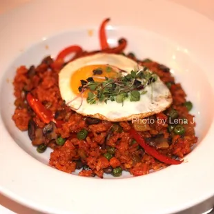 Mushroom Paella ($29) saffron-spanish rice / shiitake / peas / tomato / sunny-side egg
