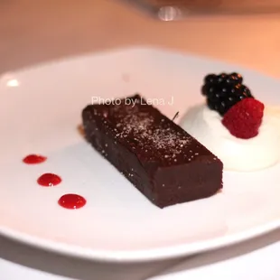 Chocolate Bodino Squares ($11) raspberry coulis / berries / brandy whipped cream. Very rich. Whipped cream is quite sweet.