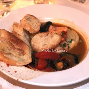 Bouillabaisse ($37) salmon / shrimp / mussels / tomato / fennel / Thai lobster broth