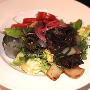 Shaking Beef ($29) hanger steak / mixed greens / tomato / onion / jalapeño / citrus dressing