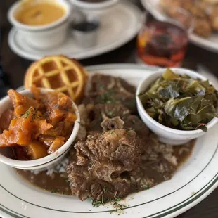 Oxtails w/Rice, sweet potatoes and collards.  With corn bread &quot;biscuit&quot; (shaped into a waffle)