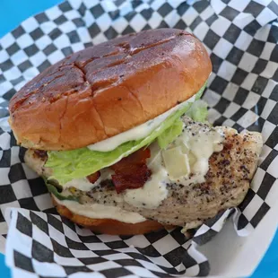 a burger with lettuce and bacon