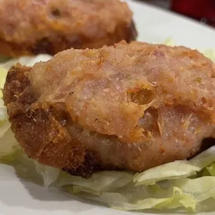a plate of fried chicken and lettuce