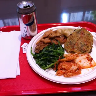 a plate of food on a red tray