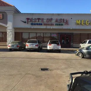 cars parked in front of a restaurant