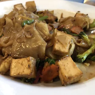 tofu and vegetables on a white plate