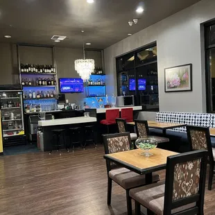 a restaurant with tables and chairs