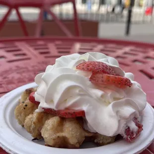 a strawberry shortcake with whipped cream