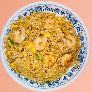 a plate of fried rice with shrimp