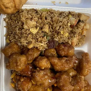 Orange chicken with fried rice and an egg roll.