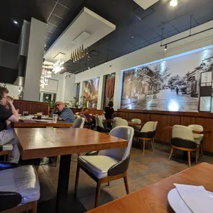 people sitting at a table in a restaurant