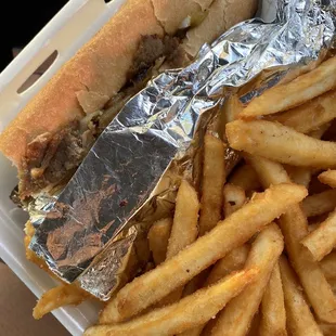 Chicago cheese steak  with fries! Best juicy cheese steak I&apos;ve ever eaten.. well seasoned meat and fries.. a good run for your money!