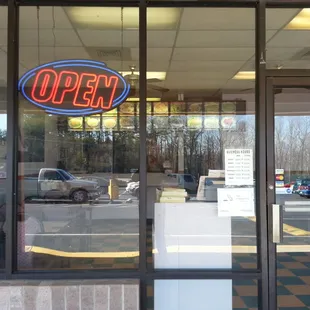 open sign in window of restaurant