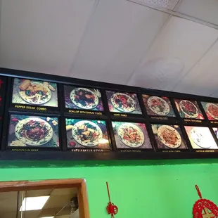 menus on a green wall