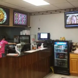 a woman ordering food at a restaurant