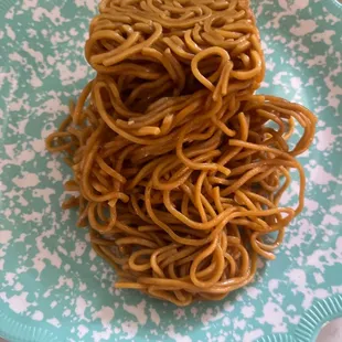 a plate of noodles on a table