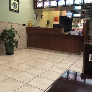 a restaurant counter and tiled floor