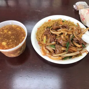 a plate of food and a cup of soup