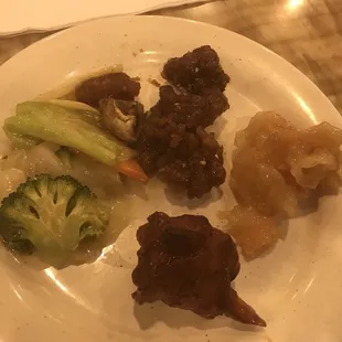 Clockwise from top L: vegetables deluxe, Sesame Chicken, coconut shrimp, buffalo wing