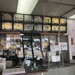 Menu items and displays newly installed protective barriers and a delivery system to keep everyone safe and contactless in store.