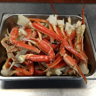 crab legs in a pan