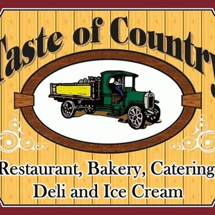 a sign for a restaurant, bakery, catering, deli and ice cream