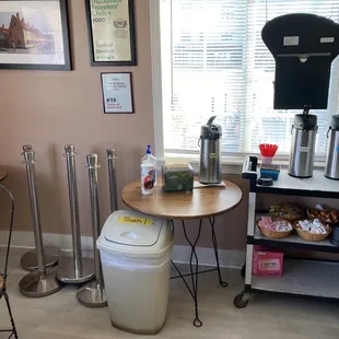 a kitchen with a table and chairs