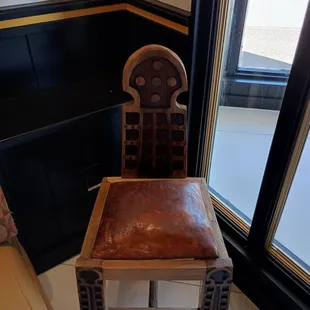 A cool chair. They have amazing paintings too. They also have more beautiful stuff in the other side of the restaurant.