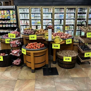 a variety of fruits and vegetables in a grocery store