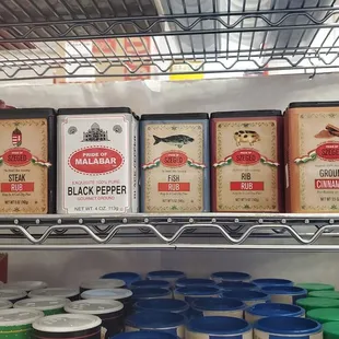 a shelf of spices and condiments