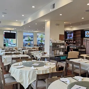 a dining room with tables and chairs