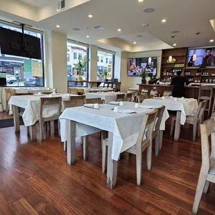 a restaurant with tables and chairs