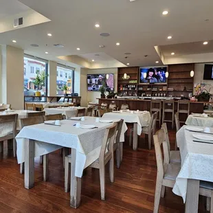 a restaurant with tables and chairs
