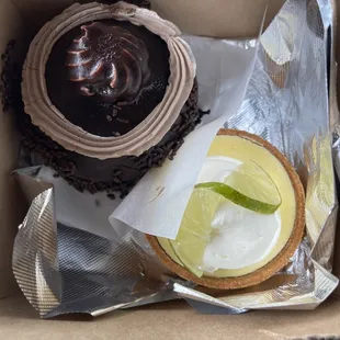 a chocolate cupcake and a lime slice