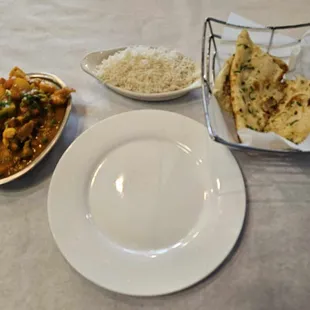 a plate of food and a bowl of rice