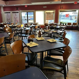 a restaurant with tables and chairs