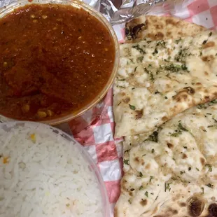 Chicken Vindaloo Curry extra spicy, garlic naan. Delicious and easily enough for two.