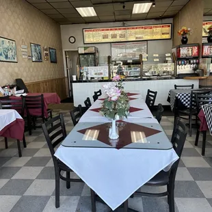 a dining area with tables and chairs