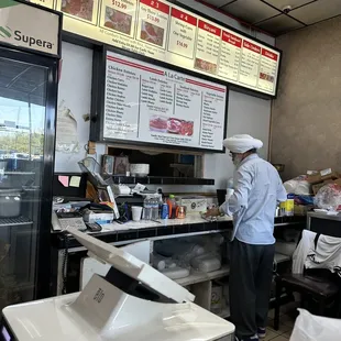 a man preparing food in a restaurant