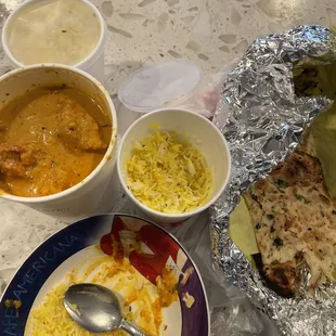 Large Butter Chicken Togo with garlic naan bread and balsami rice!