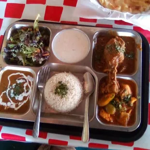 Friday's Thali at the Taste of India restaurant. Curry Chicken, Kadai Chicken, Kheer, and Daal Makhani.
