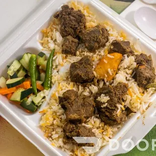 a close up of a meal in a styrofoam container